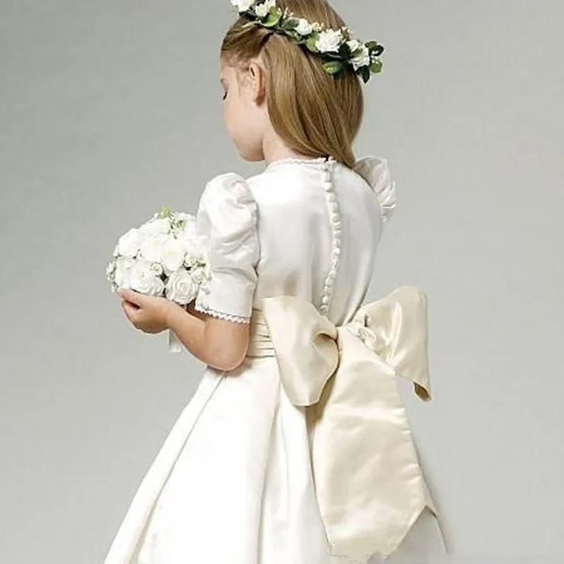 

Ivory Satin Flower Girl Dresses With Champagne Bow Sash Jewel Neck Ankle Length Bubble Short Sleeves Lace Hemline Girls Dresses