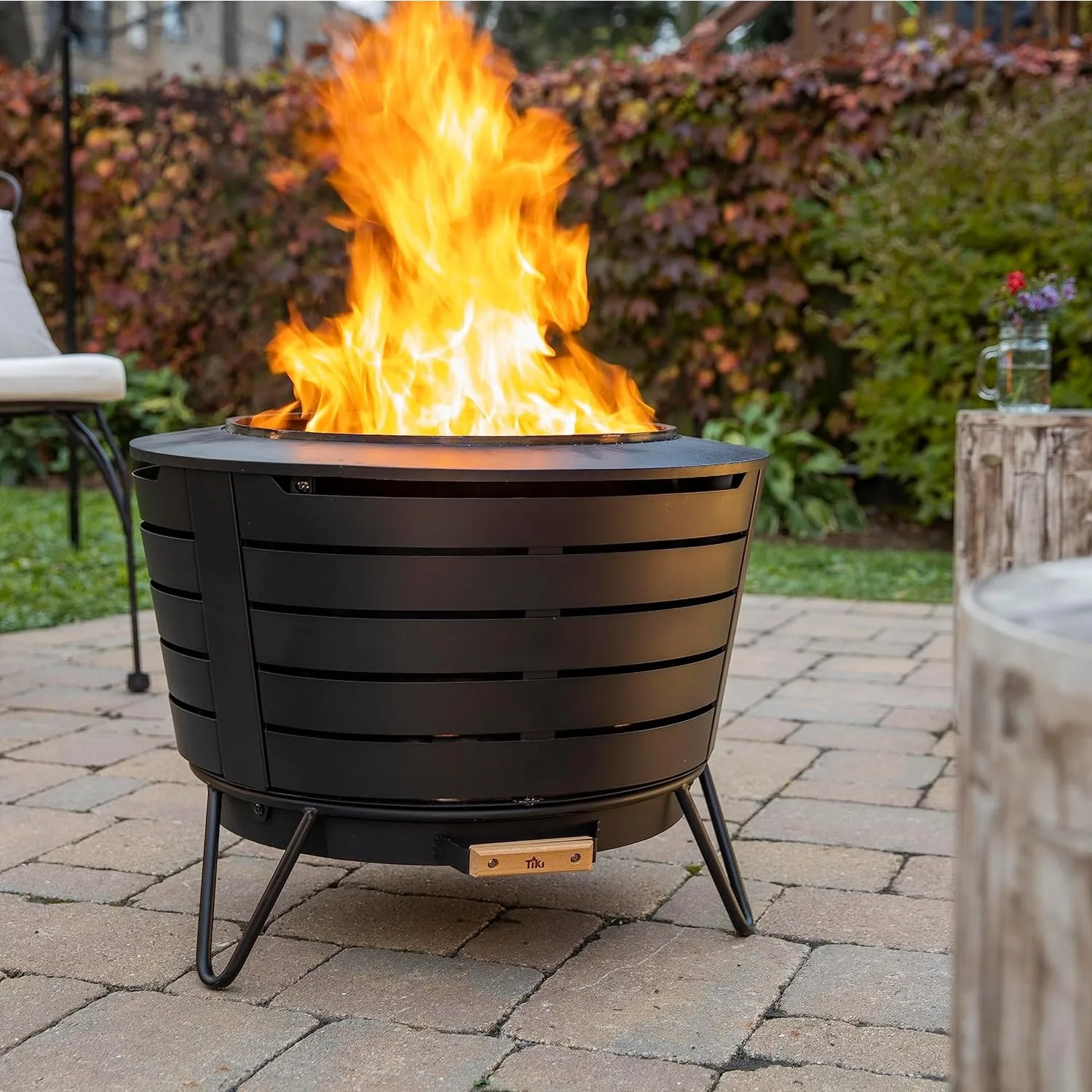 TIKI Brand Patio Fire Pit Wood Burning Outdoor Fire Pit 25 in. Includes Pack Modern Design Removable Ash Pan