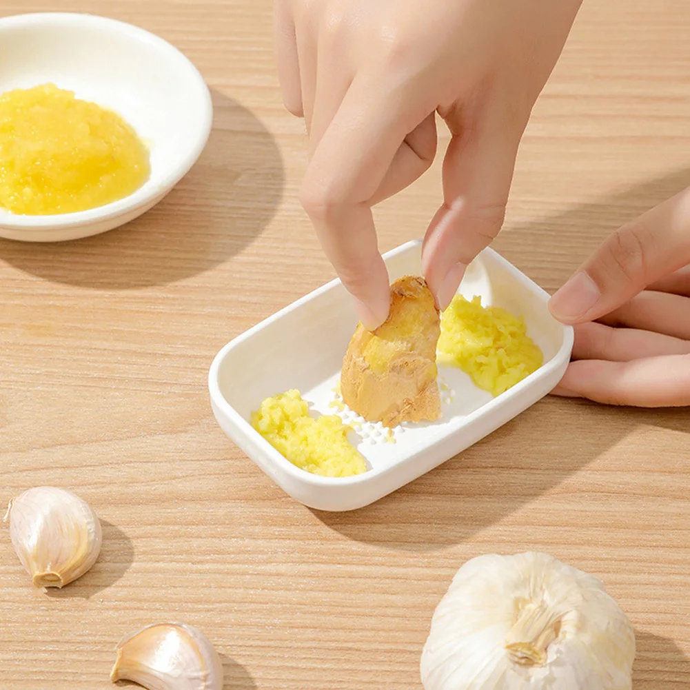 https://ae01.alicdn.com/kf/Saac7d08326de49b8b53bc564385d4d48y/Multi-Function-Ceramic-Ginger-Garlic-Wasabi-Grater-Crushed-Garlic-Press-Device-Hand-Held-Grinding-Slicer-Kitchen.jpg