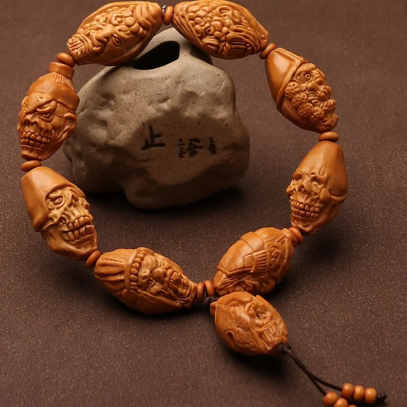 

New Hand Carved War Soul Bracelet Stone Carving Skull Handheld Piece Olive Nut