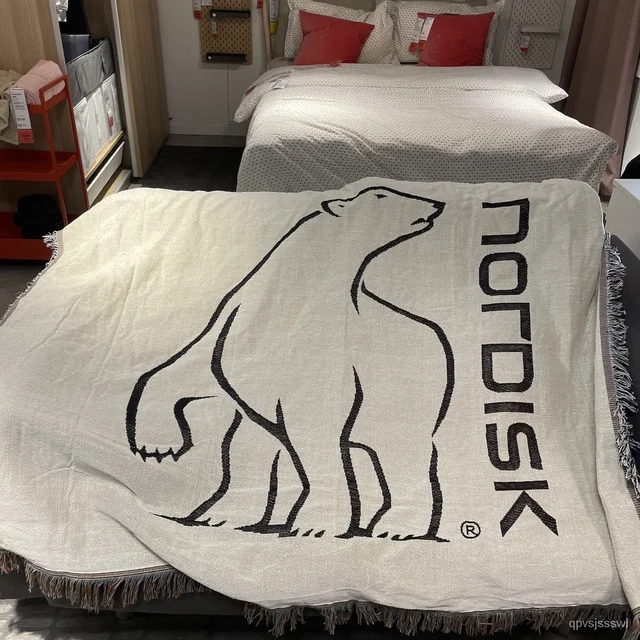 Cozy and versatile Nordisk Blanket for picnics and home decor