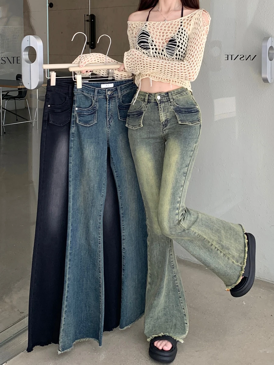 Real time photo of retro washed micro horn jeans for women with a high waisted elastic edge and horseshoe slipper trend