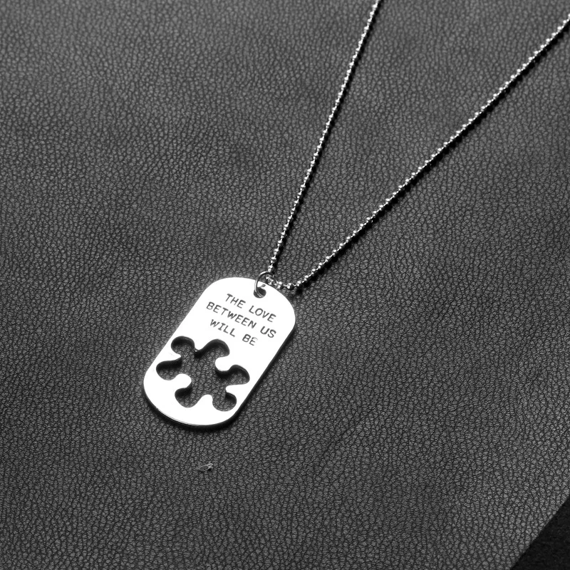 Interlocking heart puzzle necklace displayed in gift box