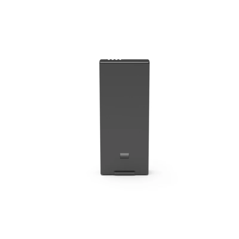 Trois batteries rechargeables et hub central du kit éclairage sécurité sans fil, posés sur une table.