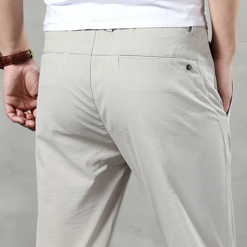 Ice silk casual pants for men in summer, thin, loose, elastic, quick drying trousers, new business suit, men's pants, long pants