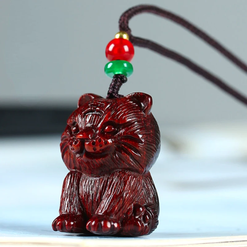 

Red sandalwood wood twelve zodiac cute little tiger pendant, mahogany men and women creative sweater necklace cartoon pendant