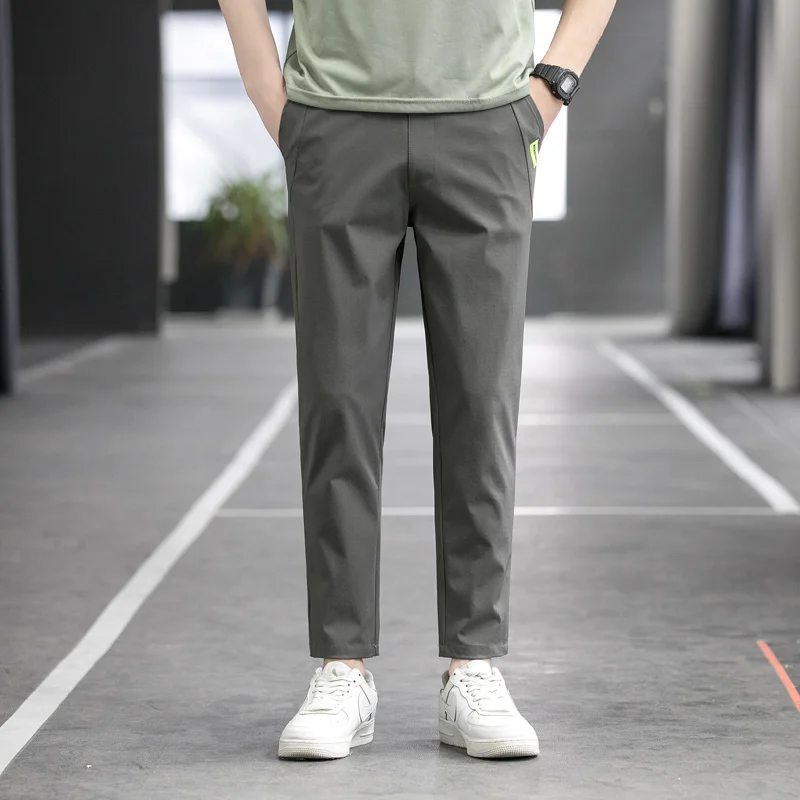 Men's Spring Autumn Elastic Casual High Waist Solid Pockets Letter Patch Casual Harlan Feet Trousers Cargo Office Lady Pants