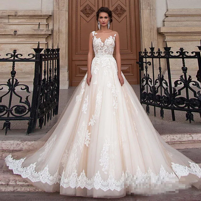 

2023 Transparent Scoop Champagne Wedding Dresses with Detachable Beading Sash Lace Applique Sleeveless Backless Bridal Gowns