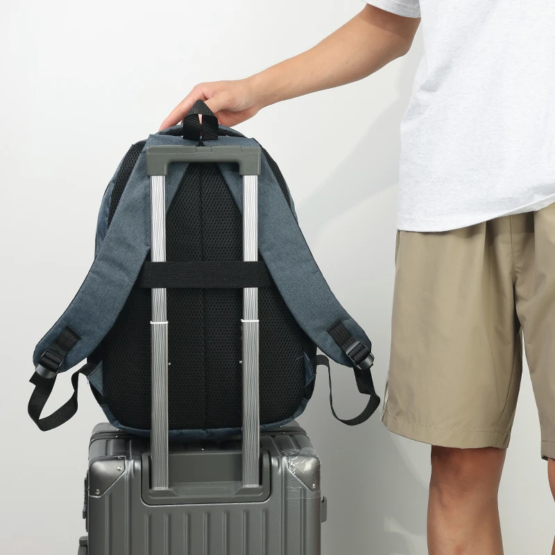 Large-capacity laptop bag with adjustable shoulder strap and trolley sleeve, durable nylon lining, and zipper closure