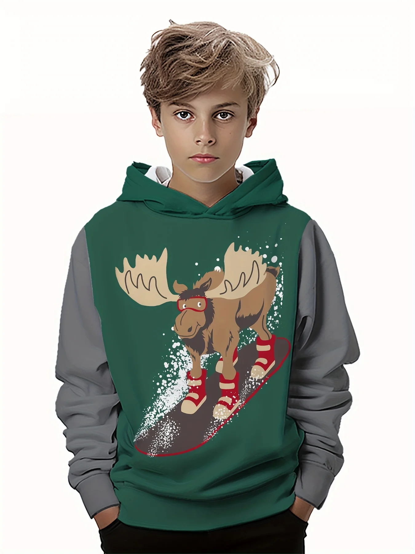 Smiling bpy wearing a colorful 3D hoodie with long sleeves, standing outdoors with playful energy moose