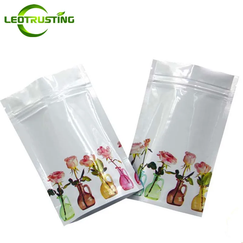 

Leotrusting 100pcs Glossy Rose Flower Aluminum Foil Zipper Bag Stand up General Use Resealable Women Dressing Beauty Gloves Bags