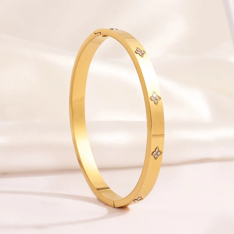 RAKOL Niche الموضة الفولاذ المقاوم للصدأ زهرة الزي...