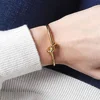 MEDFOLY Adjustable Gold Bangle Bracelet for Women 14K Gold Plated Forever Love Knot Infinity Bangle Bracelets Jewelry Gift 4