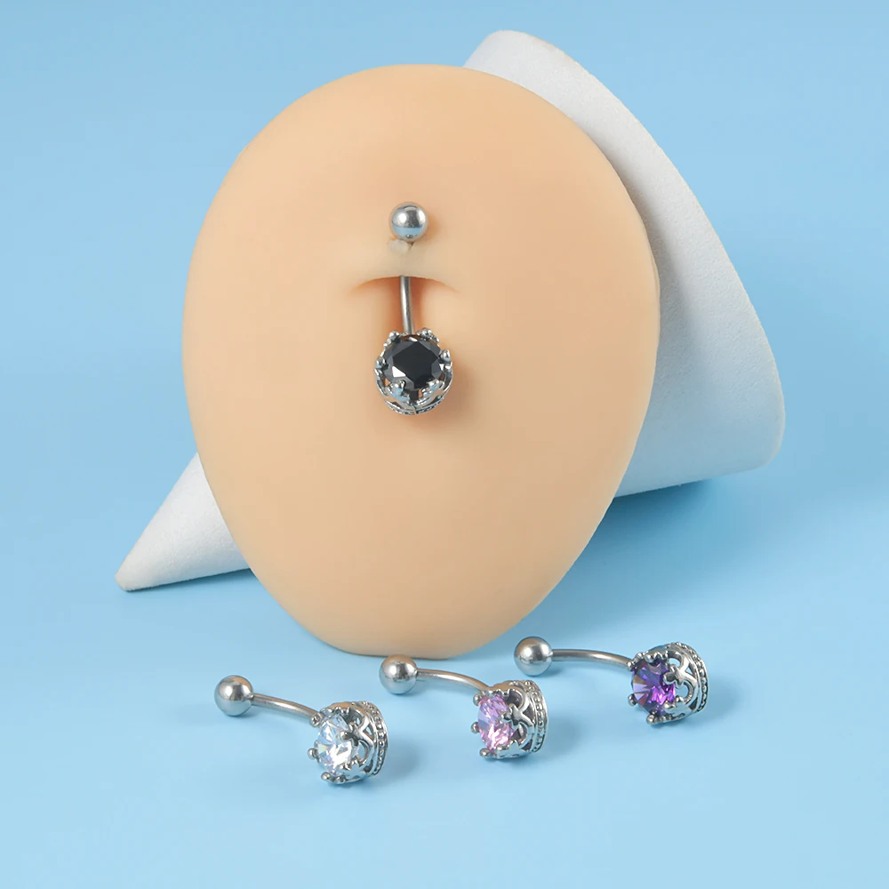 Steel belly button piercing – a cross adorned with tiny zircons, a round  zircon