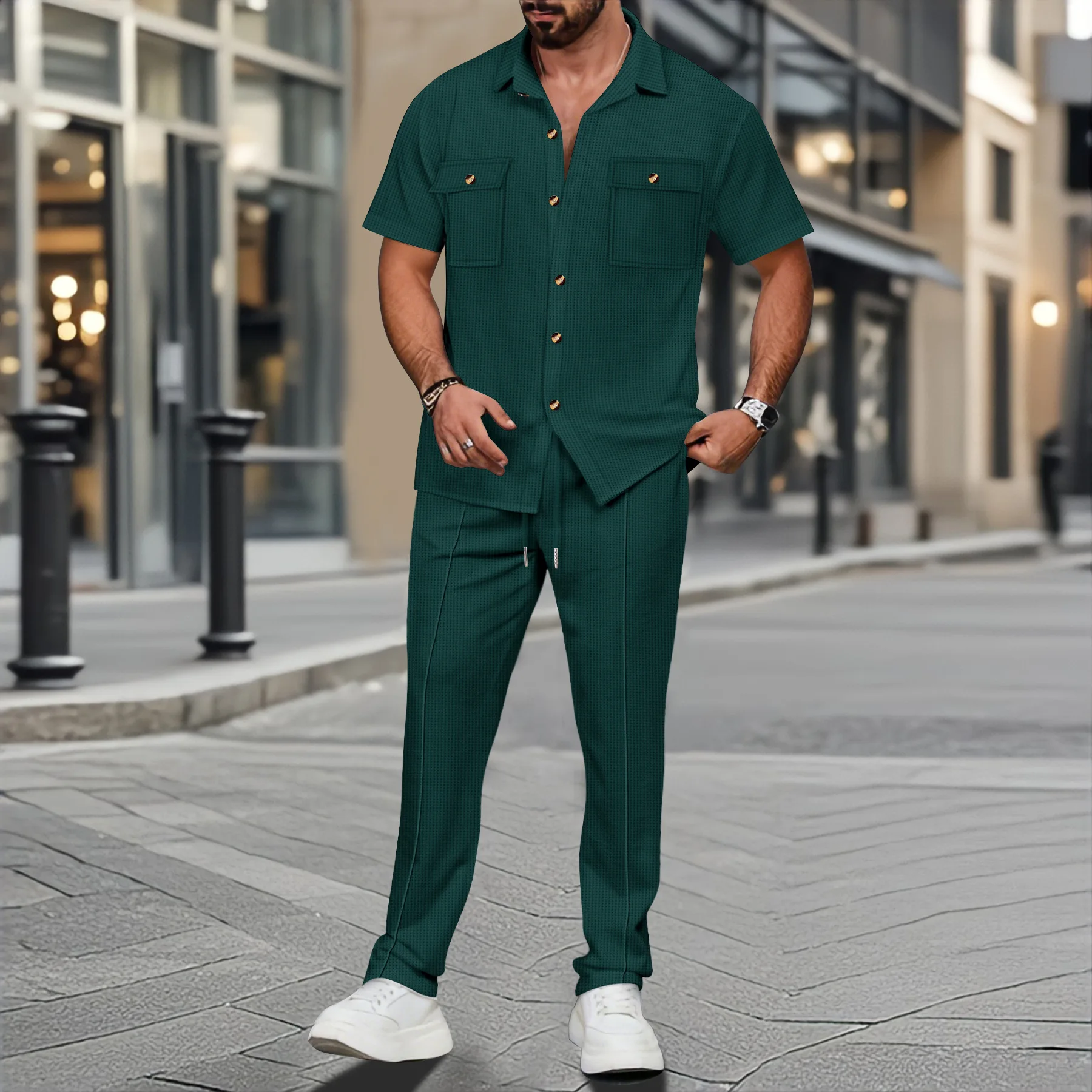 Men’s solid color waffle check short sleeve shirt and trousers two-piece set displayed on model in outdoor travel setting green