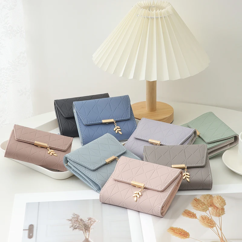 Autumn and winter new women's short wallet Japan and South Korea small fresh simple PU folding device straw necklace three-fold