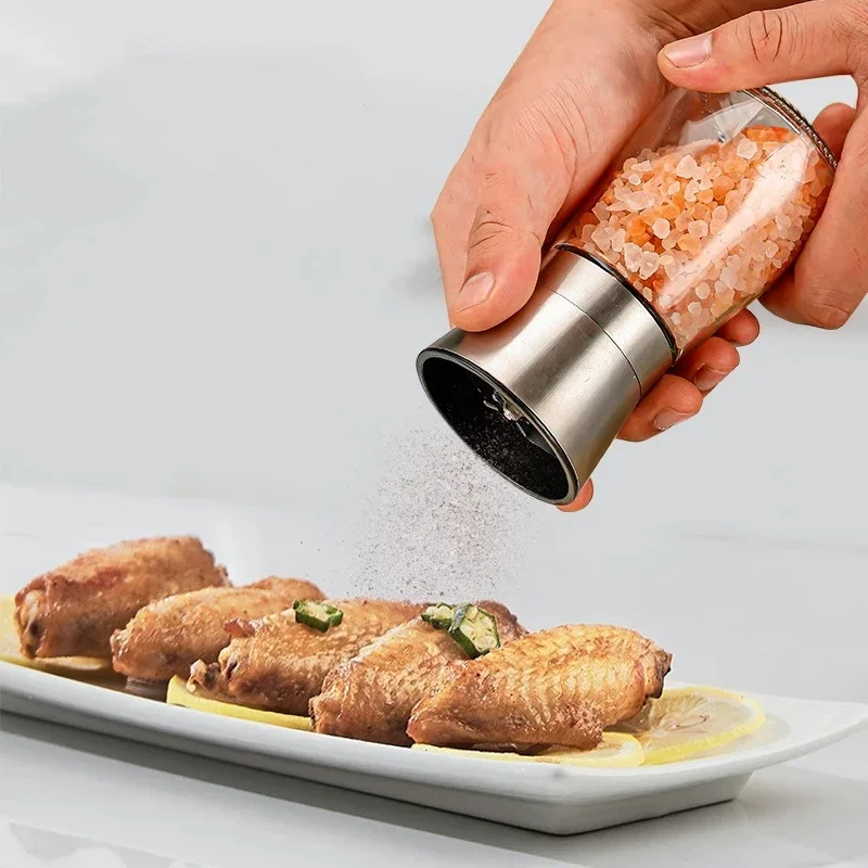 Kitchen supplies, manual grinder, pepper, Sichuan peppercorns, coarse salt, cumin, sesame seeds, and other sprinkling bottles