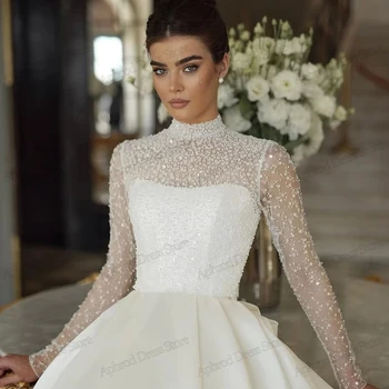 Abiti da sposa glamour Splendidi abiti da sposa Applicazioni di perline Collo alto Maniche lunghe Squisiti abiti da sposa personalizzati