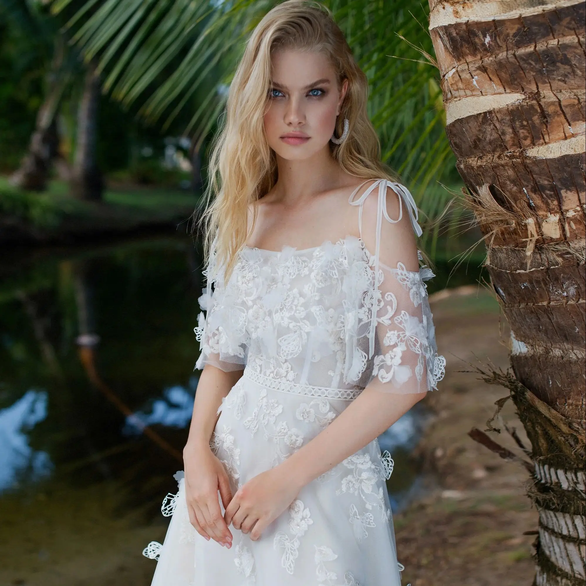 

FATAPAESE Wedding Dress Made with Gorgeous Tulle with 3D Laser-Cut Floral Embellishments Off-Shoulder Sleeves a Flowy A-Line