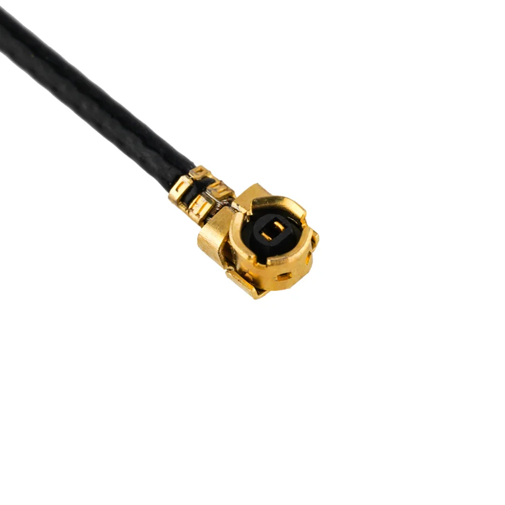 Antenne T Bi-Bande 2.4GHz & Sub-G 900MHz pour FPV Xrossband ELRS posée sur une surface, avec ses deux brins rayonnants distincts.