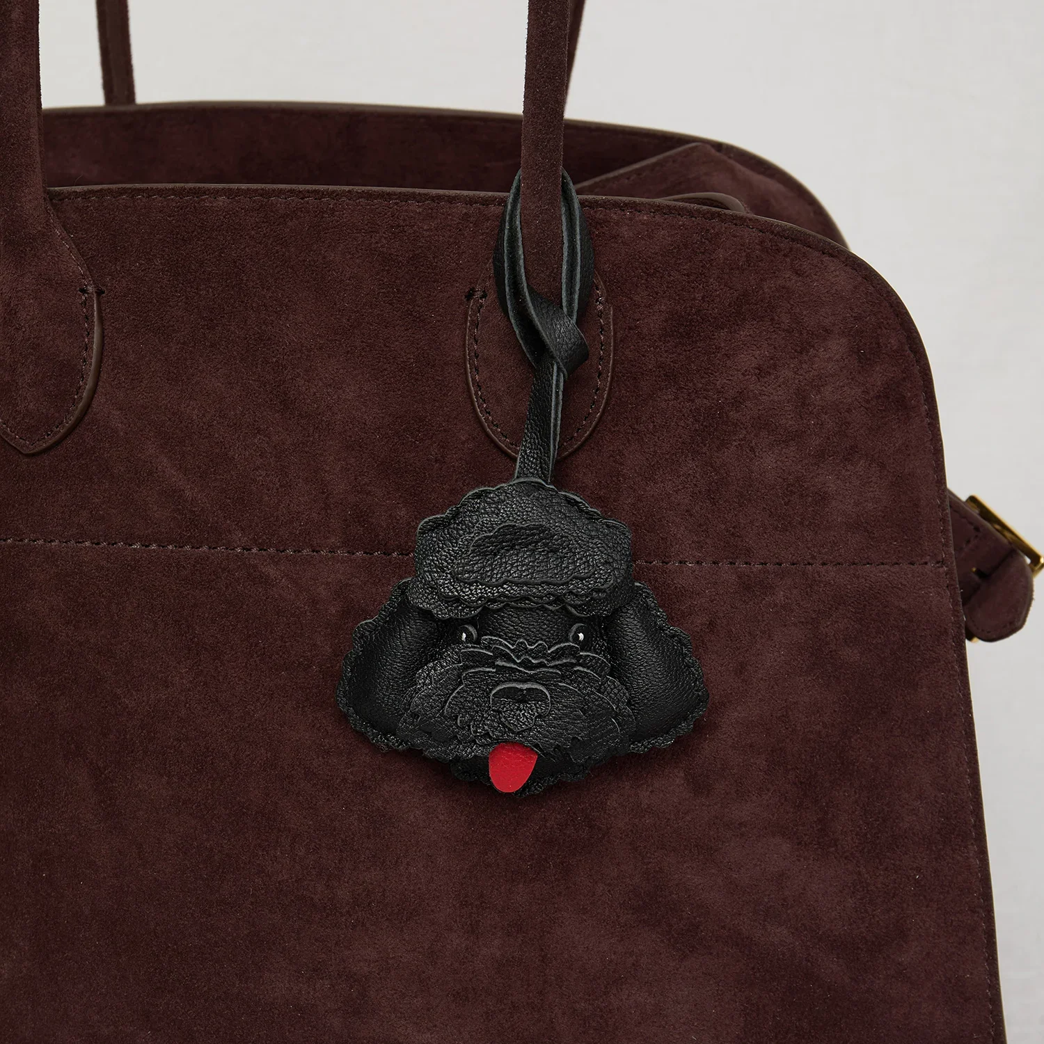 Teddy dog leather bag charm close up