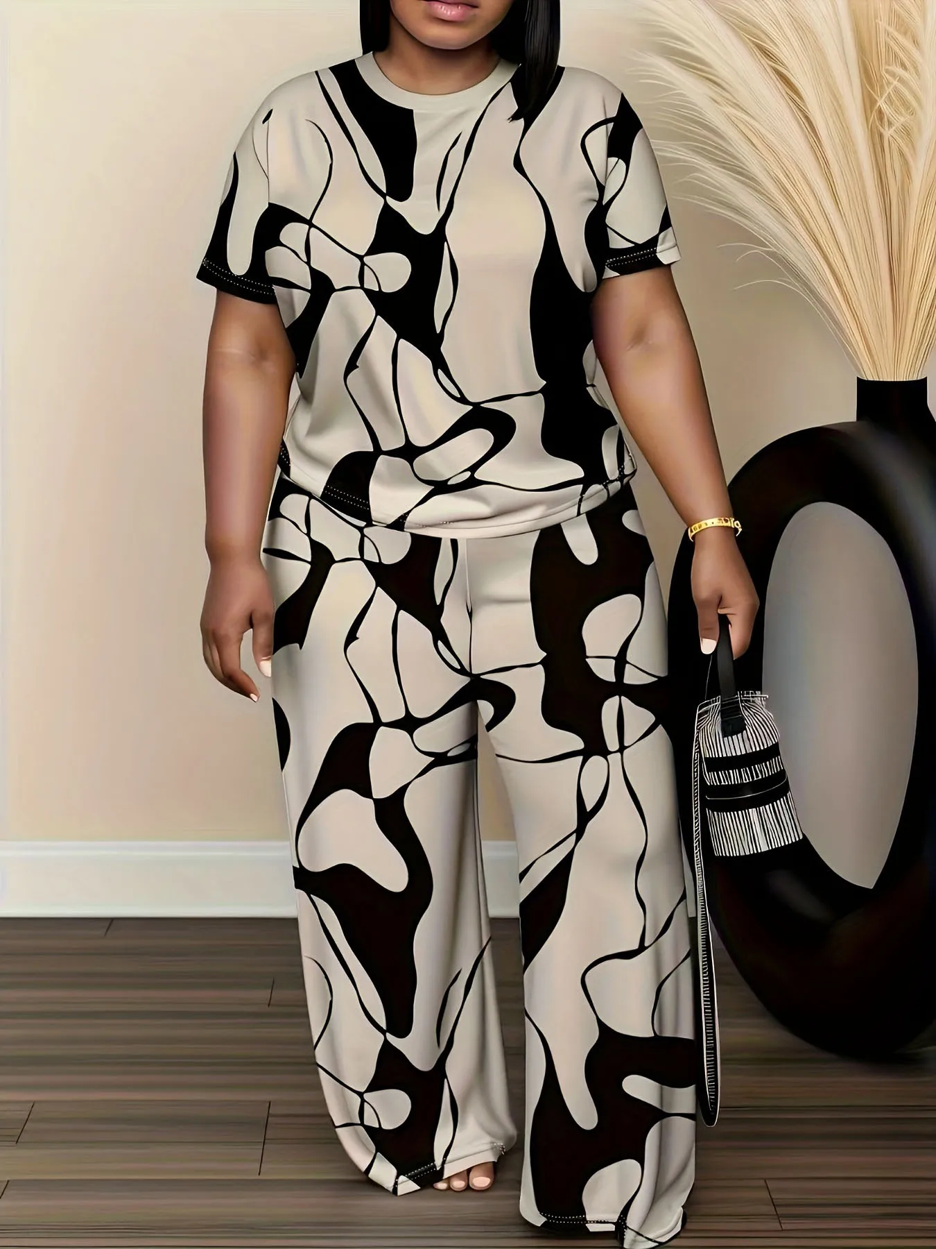Women's summer fashion print two-piece outfit with round-neck short sleeve T-shirt and wide-leg trousers in a relaxed fit. 658