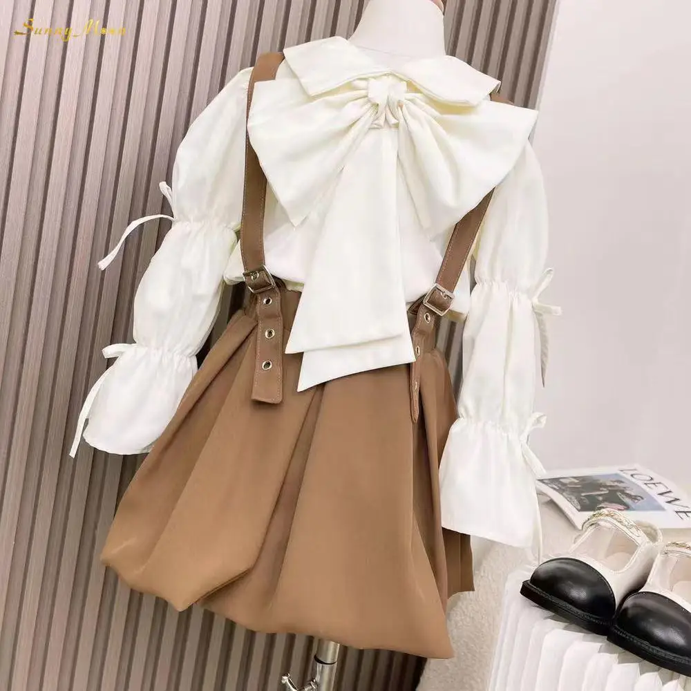

Fashion baby infant toddler child cute casual girl spring and autumn bow cuff shirt + suspenders skirt clothesset 2pcs 1-12Y