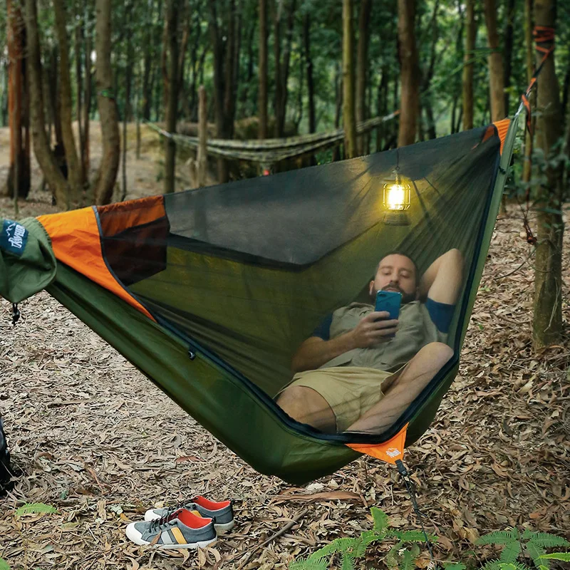 Travelers camping outdoors with mosquito net hammocks, increased anti roll over speed, anti mosquito hammocks