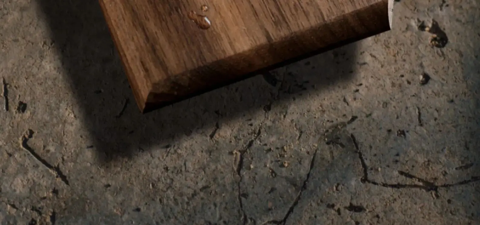 detail of brass lever on walnut panel