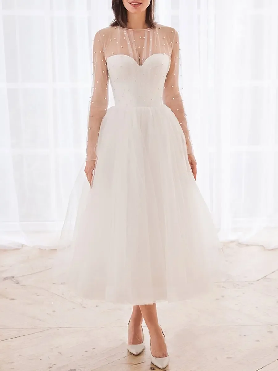 

Женское платье с длинным рукавом и круглым вырезом