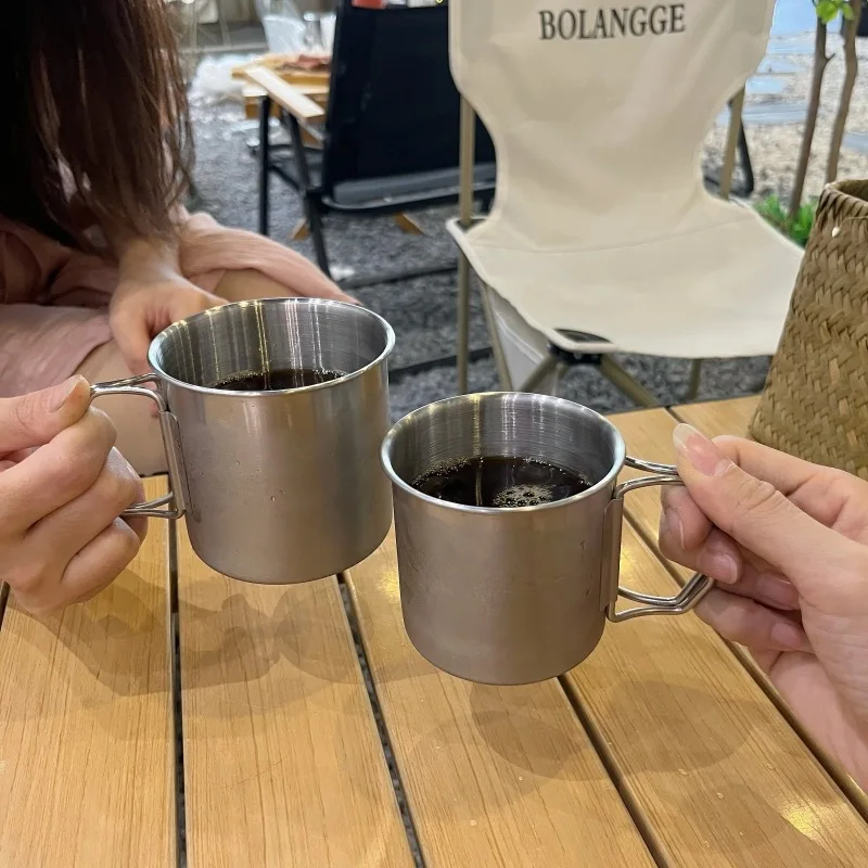 https://ae01.alicdn.com/kf/Saed4ffaa9c344143bfe911a593e9a4eaa/304-Stainless-Steel-Coffee-Cups-Portable-Carabiner-Outdoor-Folding-Handle-Camping-Beer-Mug-For-Home-Drinkware.jpg