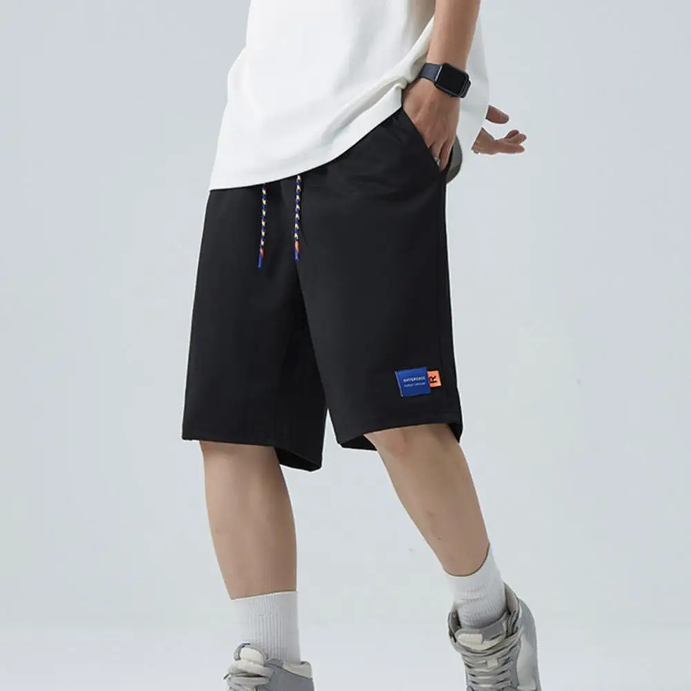 

Men Shorts Mid-Rise Elastic Waistband Drawstring Pockets Wide Leg Logo Print Loose Fitness Running Pants Quick Drying Sportwear