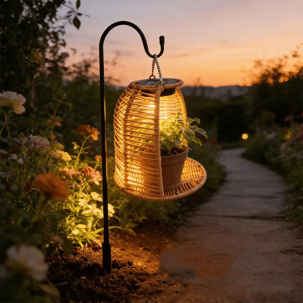 Rattan solar lantern on outdoor side table next to plant