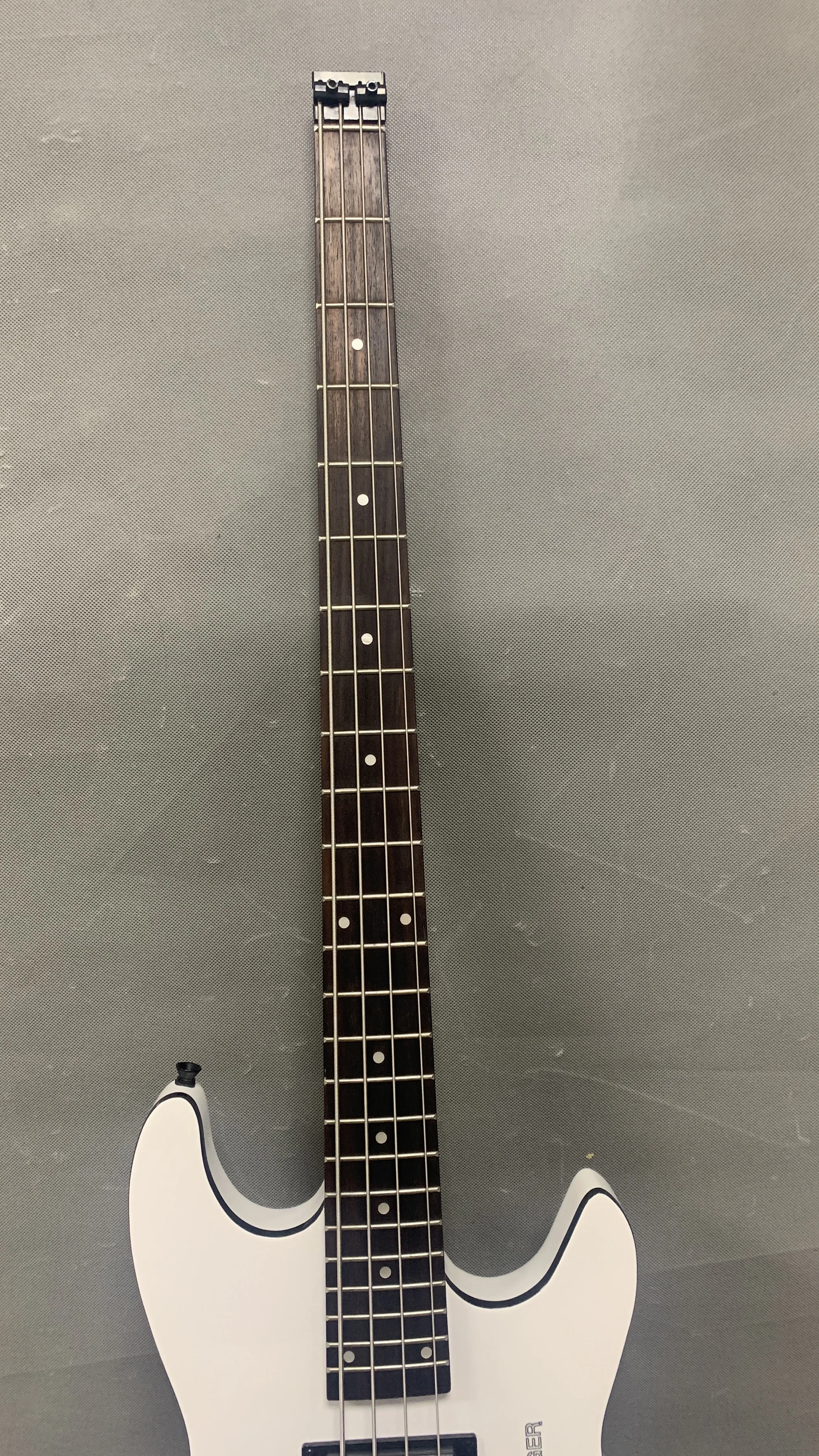 Classic 4-string headless bass guitar, white body black neck, high-end headless bridge, custom headless guitar of various styles