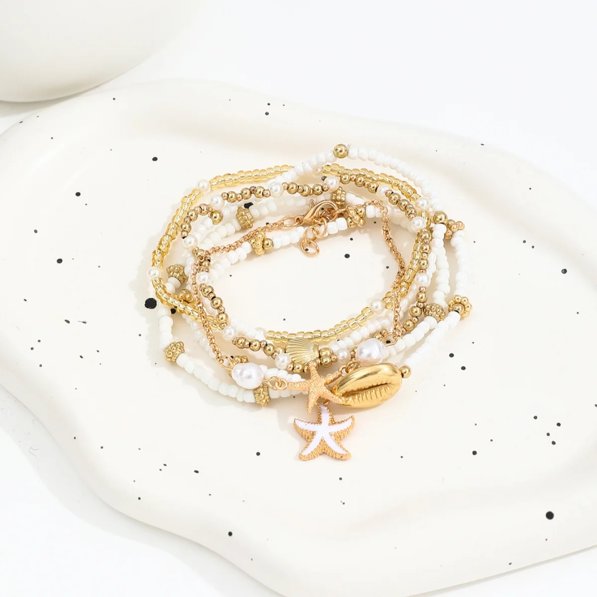 Conjunto de pulseiras vintage de missangas com estrela e concha_voghion.com