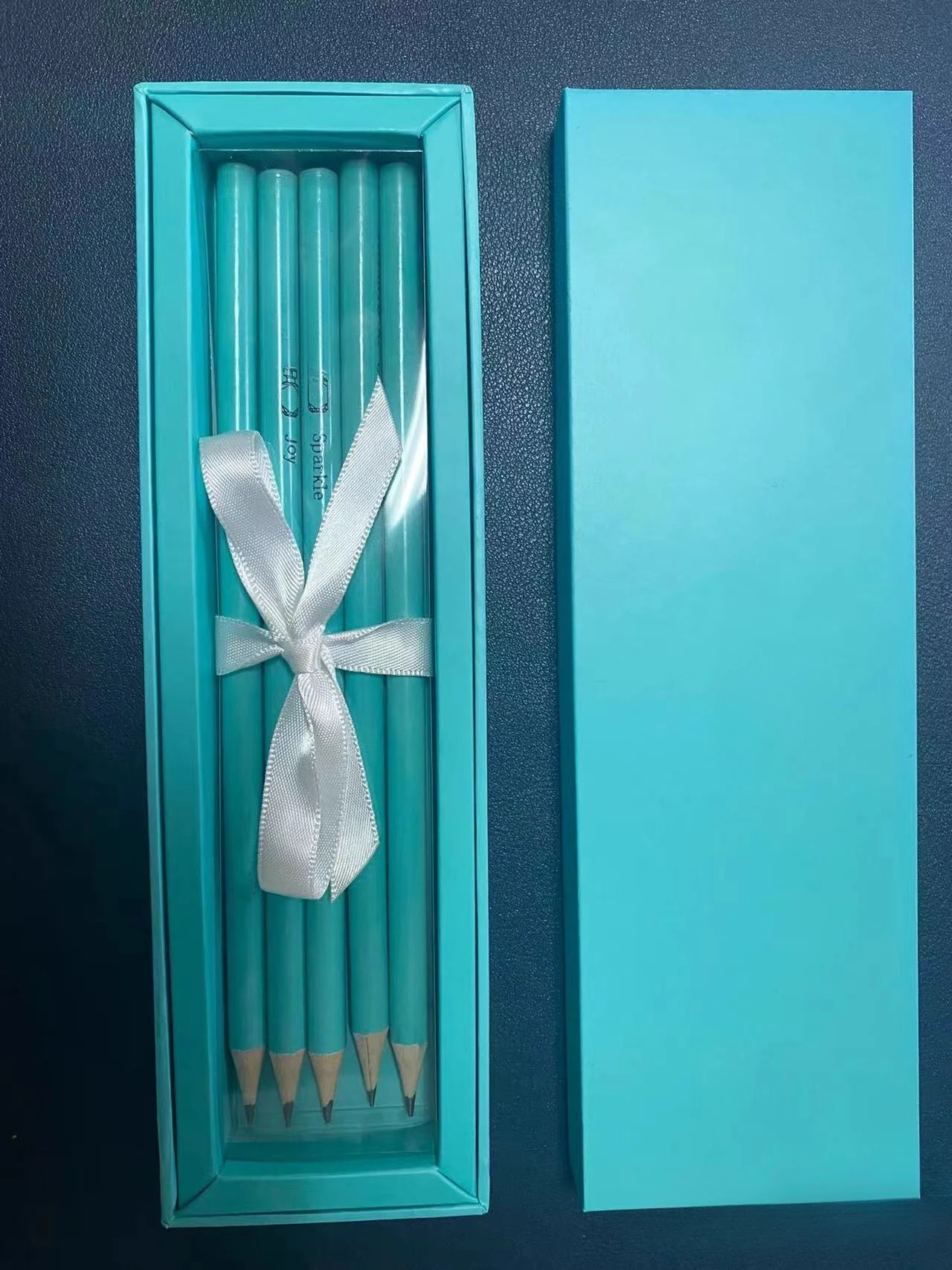 

Only the pencil T is azure