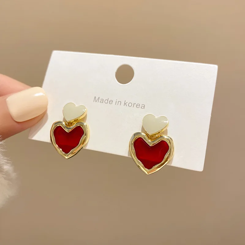Semplici orecchini a forma di cuore cavo rosso per donne ragazze moda