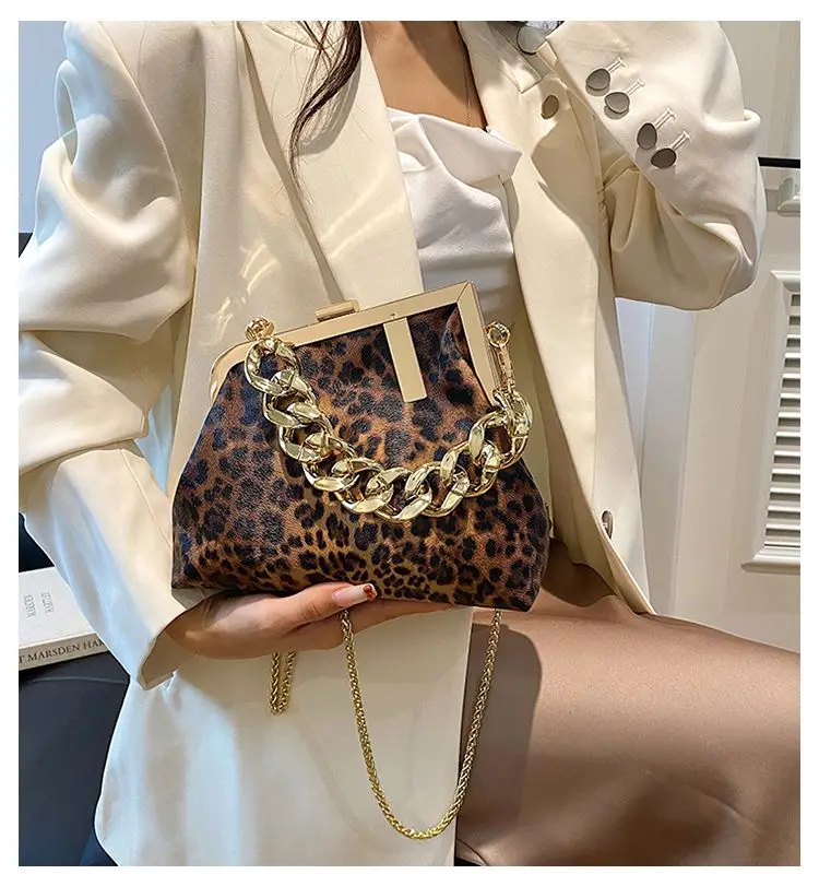 Carauana UNIU Leopard Clutch held as underarm bag