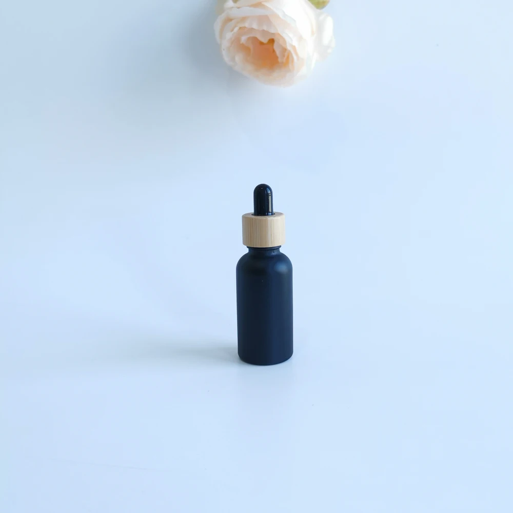 

5ml 10ml 15ml 20ml 30ml 50ml 100ml Matte Black Round Bamboo Cap Glass Dropper Bottle Essential Oil Bottle