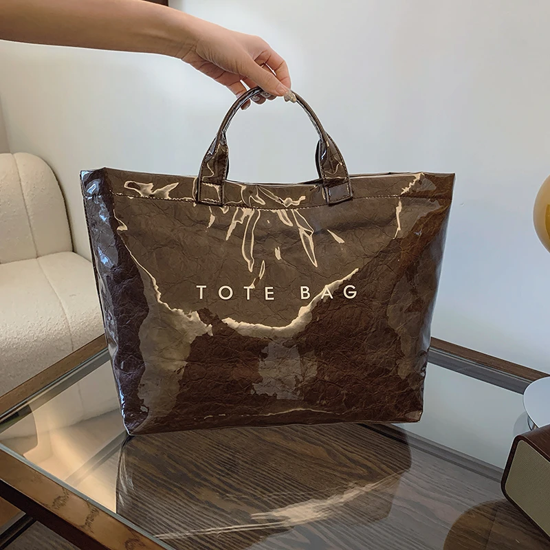 thumbnail image 1 of Bolso de mano versátil de alta gama y de moda para mujer 2024 Nuevo bolso de mano sencillo de gran capacidad para desplazamientos, 1 of 5