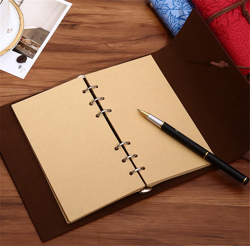 Ballpoint Pen and Blank Paper Notebook with Spiral Binding as