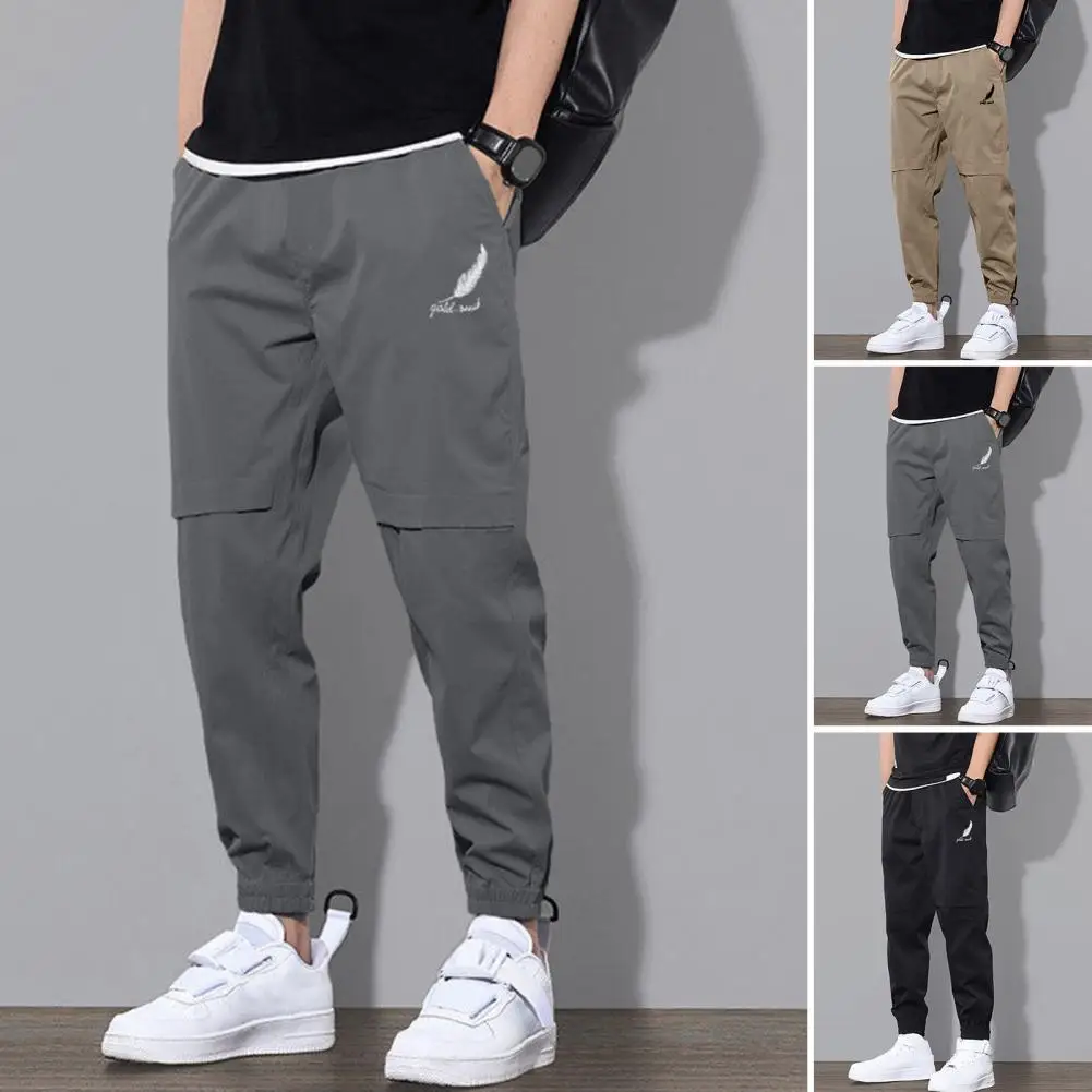 Spring and Autumn Men Pants Mid-Rise Elastic Waistband Logo Print Pockets Solid Color Casual Drawstring Sweatpants Streetwear