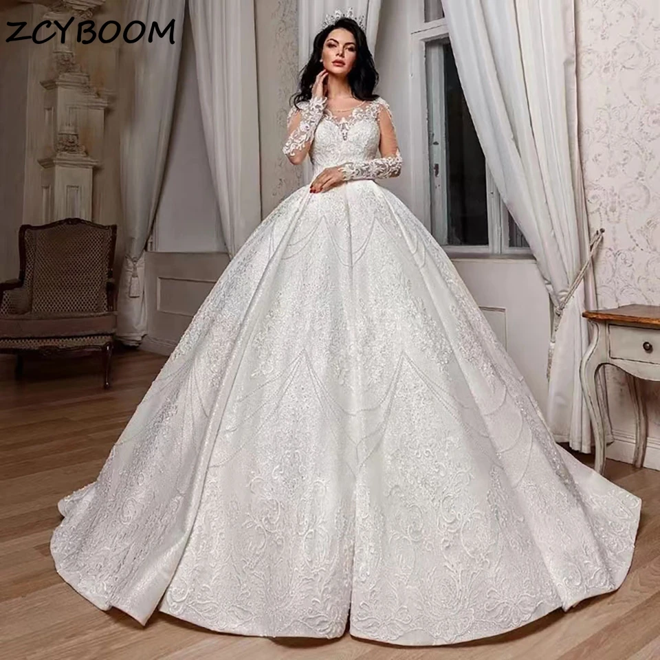 

Luxurious Sequin Shiny Beaded Crystal Wedding Dresses 2023 Illusion Long Sleeves O-Neck Court Train Tulle Bridal Gowns For Women