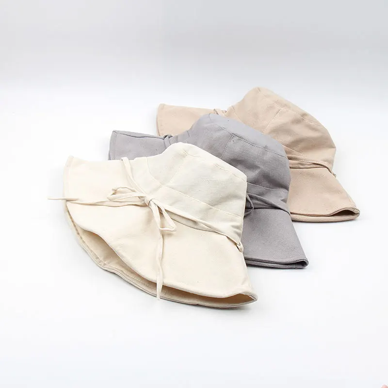

New fisherman's hat ladies Panama hat solid color bow foldable sunscreen bucket hats for men and women beach hats.