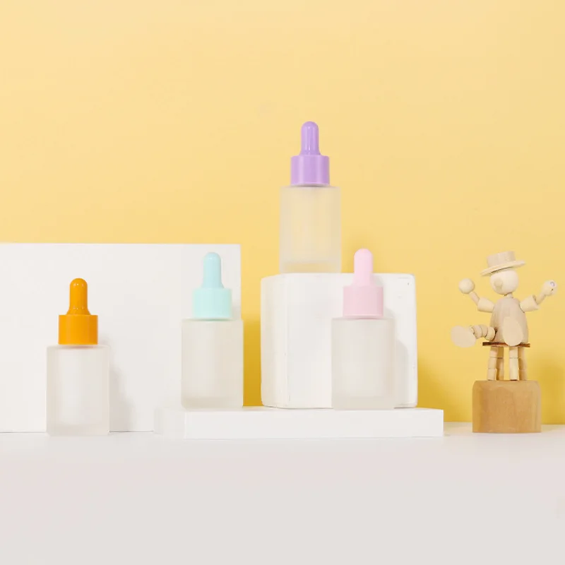 플랫 숄더 실린더 모양 30ml 유리 스포이드 병, 화이트 핑크 블루 퍼플 스킨 케어 세럼 병 10 개
