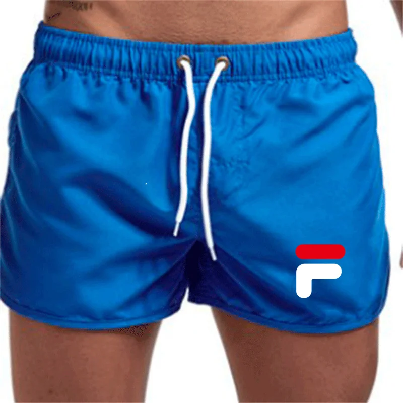 Pantalones cortos de playa para hombre, Shorts de culturismo a la moda, pantalones cortos deportivos de Fitness, Bermudas finas informales, secado rápido, Verano