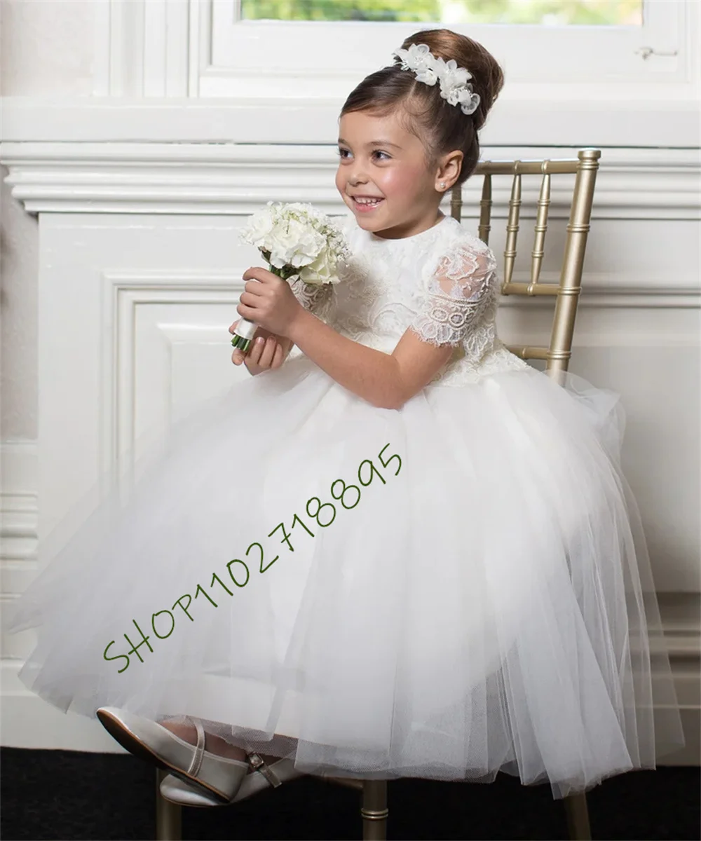 

Customzied Made Flower Girl Dreses Embellished Lace Peplum Bodice with Sleeves Finishing at the Elbows and Pearl Button