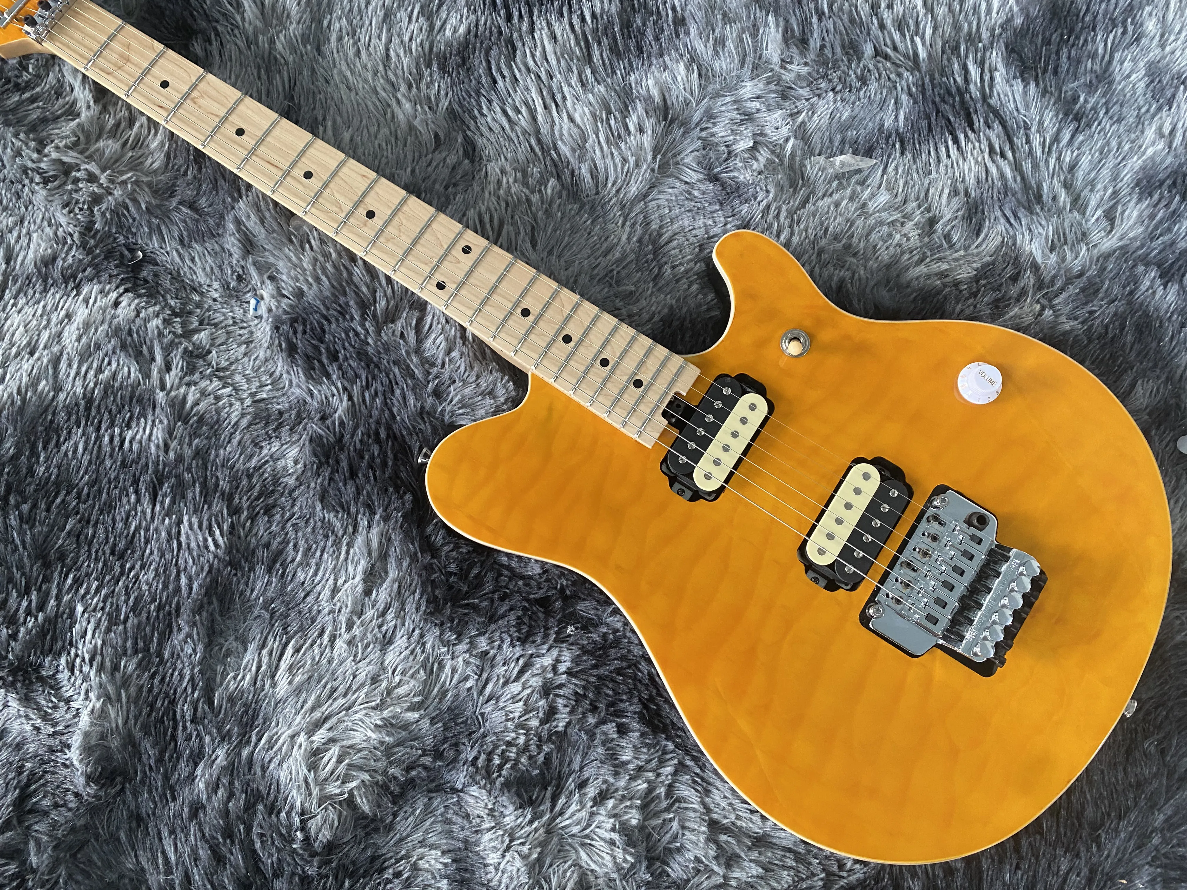 

China's Becoda electric guitar Tremolo System Yellow Red And Blue Flame Maple Top