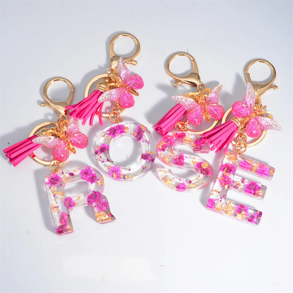 https://ae01.alicdn.com/kf/Sb148ef21254e4a73a76113890396c094z/Dried-Flower-26-Letter-Keychain-Glitter-Rose-Butterfly-Charm-Initial-Name-Keyring-for-Women-Bag-Pendant.jpg