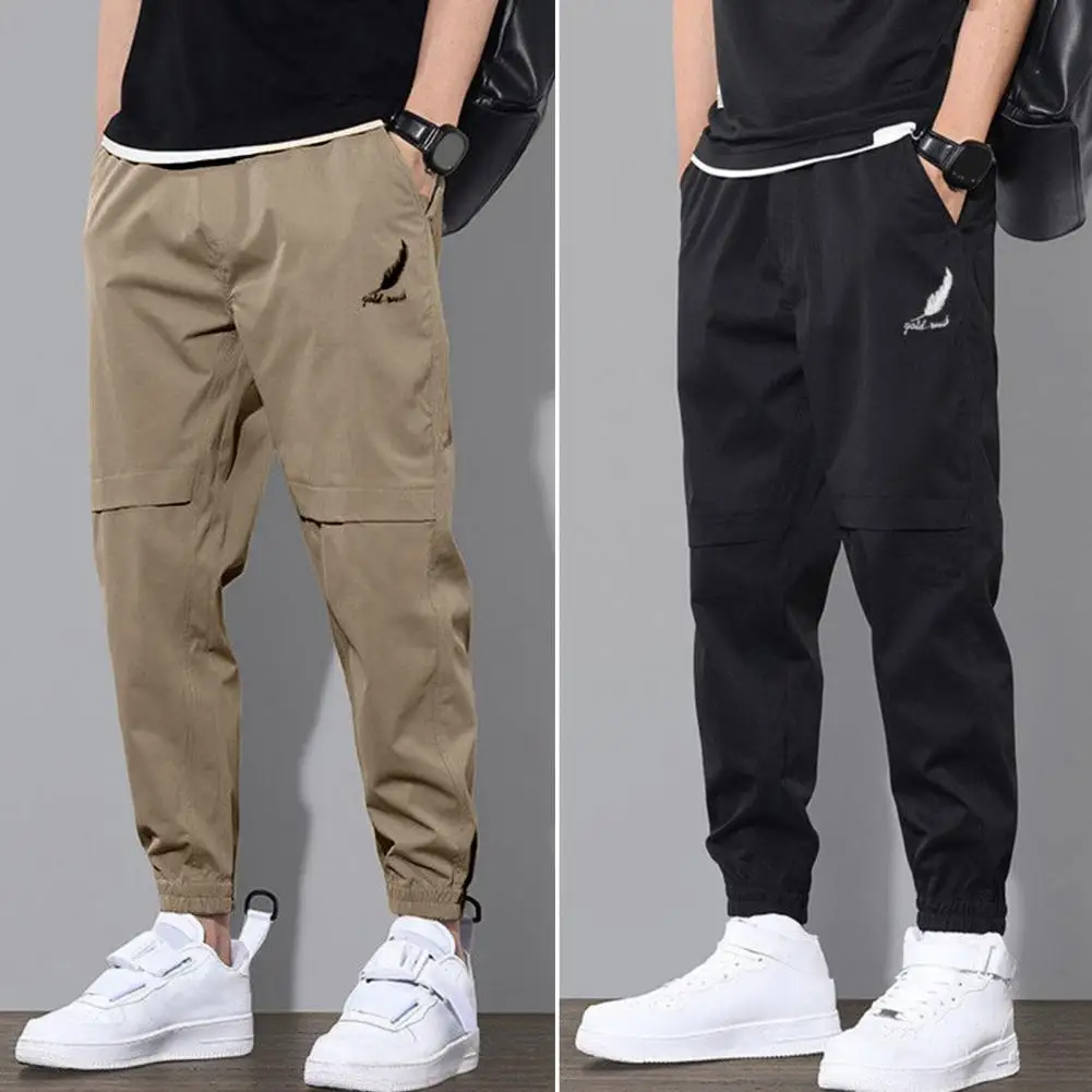 Description Picture 3 of itemSpring and Autumn Men Pants Mid-Rise Elastic Waistband Logo Print Pockets Solid Color Casual Drawstring Sweatpants Streetwear